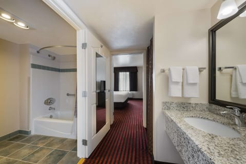 Suite, 1 King Bed, Non Smoking, Refrigerator | Bathroom | Combined shower/tub, free toiletries, hair dryer, towels