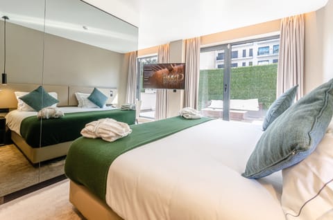 Omid Exclusive | Premium bedding, memory foam beds, minibar, in-room safe
