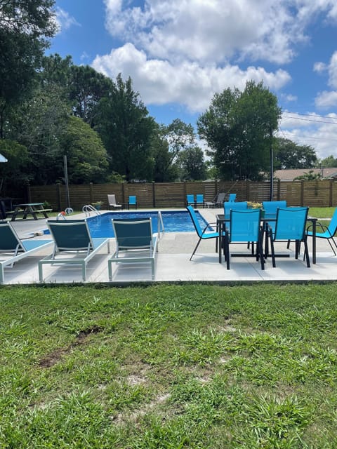 Large private salt water pool. Lounge chairs for sunbathing. Outdoor dining.
