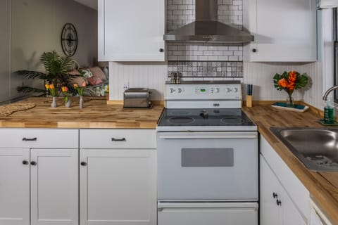 Fully equipped kitchen including a full size stove and oven