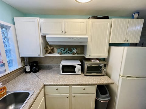 Kitchenette with microwave, coffee maker & large toaster oven/air fryer. 