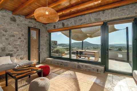Deluxe Suite | Living area | 65-inch flat-screen TV with cable channels, Smart TV