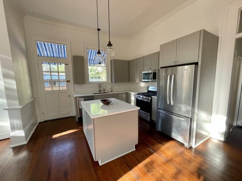 The kitchen leads to the private back patio.