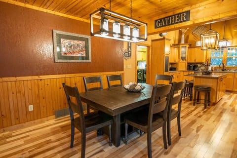 The dining room area is located between the kitchen and living room.