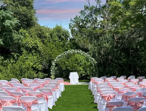 Beautiful outdoor wedding spots with moon arbor and chairs included.