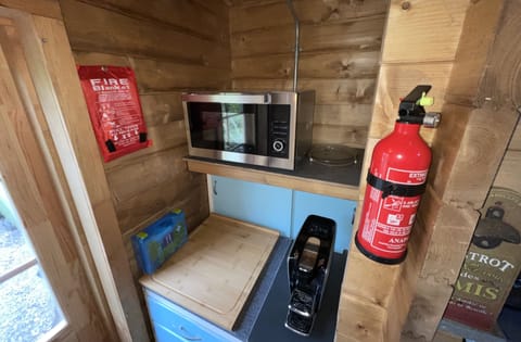 Cabin | Private kitchen | Fridge, microwave, oven, stovetop