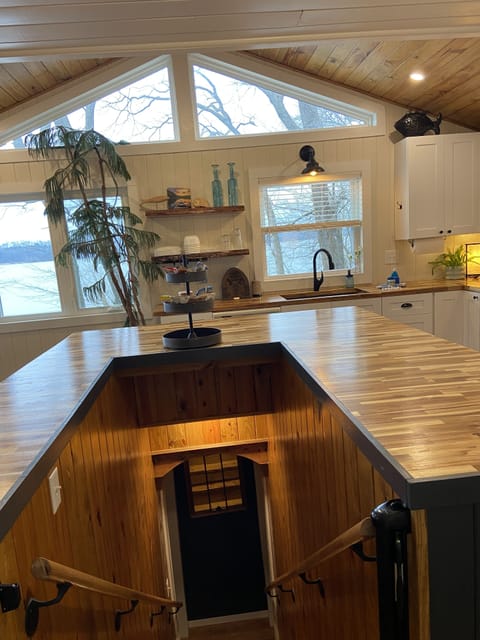 Staircase to downstairs goes under the island!