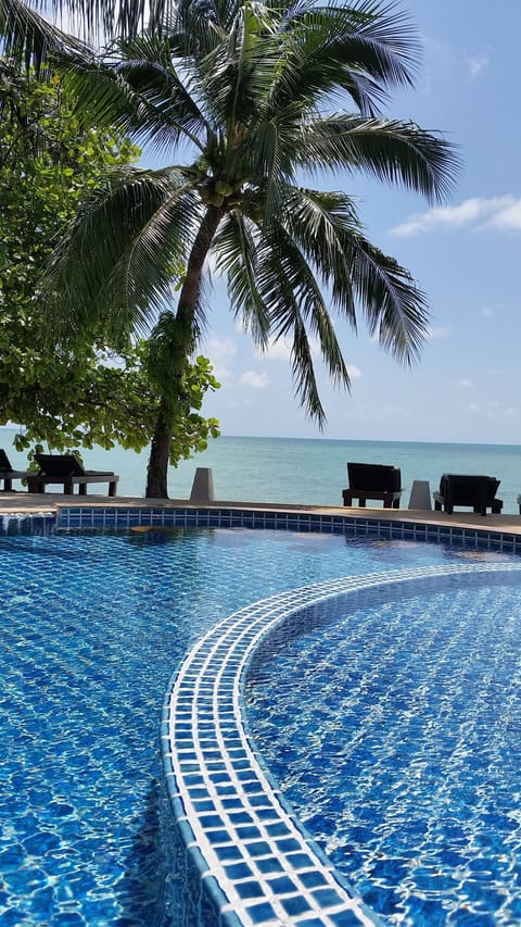 Outdoor pool, open 7:00 AM to 10:00 PM, sun loungers