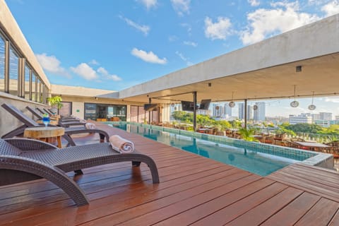 Outdoor pool, open 8:00 AM to 10:00 PM, sun loungers