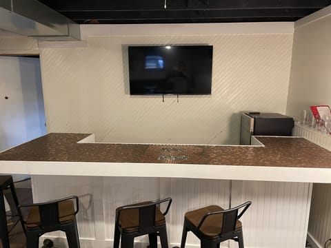 Bunker Bar with mini fridge and 50" Smart TV