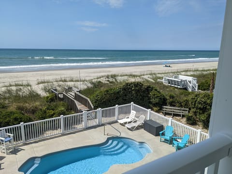 Ocean front View overlooking Beach, pool, and hot tub!