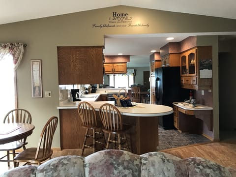 Looking from family room through kitchen, dining room and into living room.