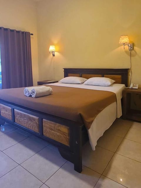 Standard Double Room, 1 Bedroom, Pool View | Minibar, in-room safe, individually decorated, desk