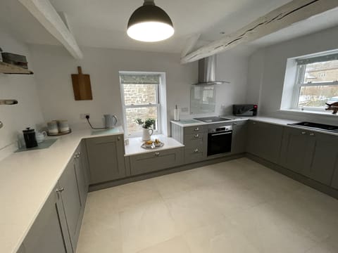 Bright, airy kitchen with table for dining