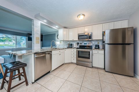 Recently remodeled kitchen with stainless appliances and brand new countertops