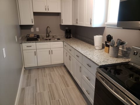 Kitchen with granite countertop.