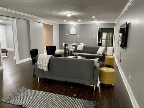 Living room and dining area. Plenty of seating around the 65 inch TV!