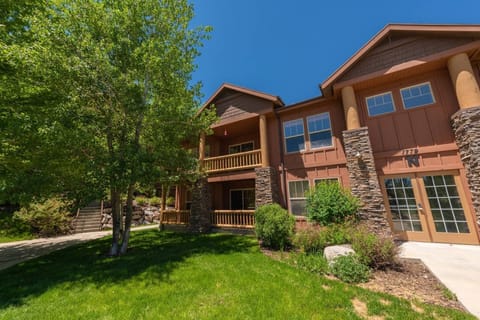 The exterior of the home is adorned with gorgeous trees and lush mountain foliage.