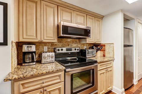 Fully Equipped Luxury Kitchen with Stainless Steel Appliances and Handsome Granite Countertops