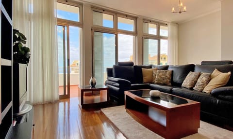 Deluxe Apartment, 3 Bedrooms, Sea View | Living area | 45-inch flat-screen TV with cable channels, TV