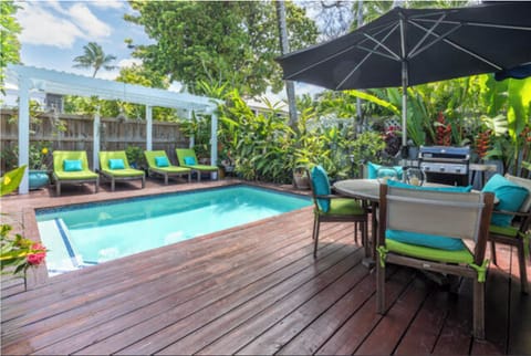 Private backyard with heated pool and outdoor shower