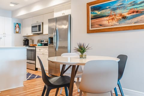 Extra chairs nearby to seat 6 + 3 more seats at the bar