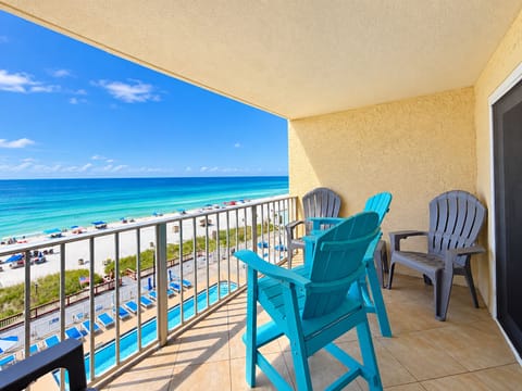 Private balcony with comfortable seating and stunning Gulf and beach views.