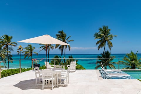 Welcome to SeaDuced, a brand new beachfront estate home with heated pool on a secluded pink sand beach.