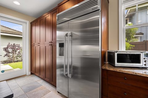Premium stainless steel refrigerator keeps your groceries fresh for island feasts and beach day picnics.