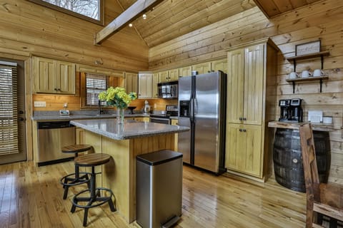 Open kitchen with breakfast bar seating for two