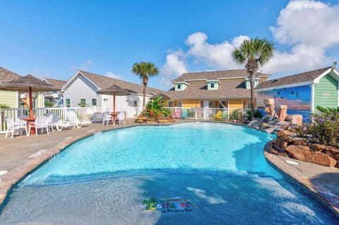 Cottages at Pirates Bay — Freeform Pool, Rock Waterfall, Colorful Cottages & Beach Mural
