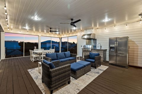 3rd Floor screened-in deck with grilling area.