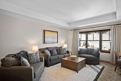 Large living room features three separate sofas.