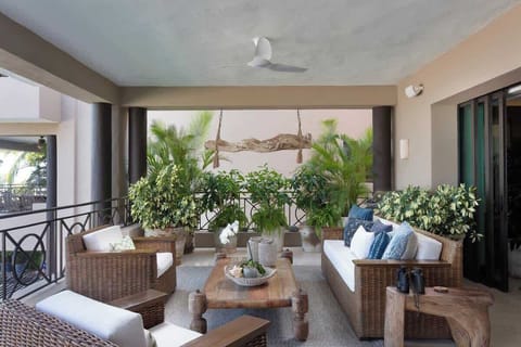 Relax on your private terrace overlooking the pool, complete with plush lounge chairs for soaking up the sun
