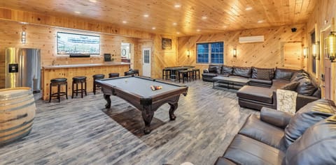 Game Room with 85" 4K Smart TV, 8' Slate Pool Table, Poker Table, SONOS Surround Sound, Wetbar, Fridge, plenty of couches, and in-floor radiant heating!