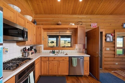 Well equipped kitchen has brand new stainless steel appliances.