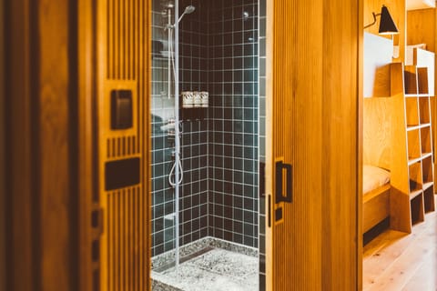 Shower, rainfall showerhead, hair dryer, towels