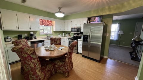 Kitchen with a dining table in the first floor.