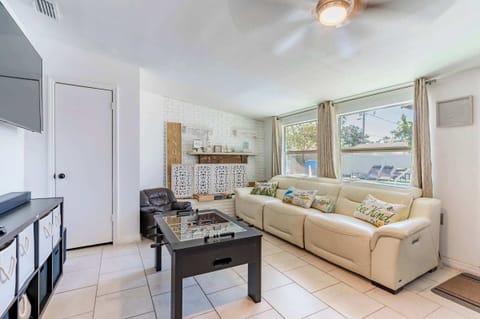 Bright & Breezy: This secondary living area gets great natural light and offers a view of the backyard/pool area. Relax on the comfy couch or start a foosball match!