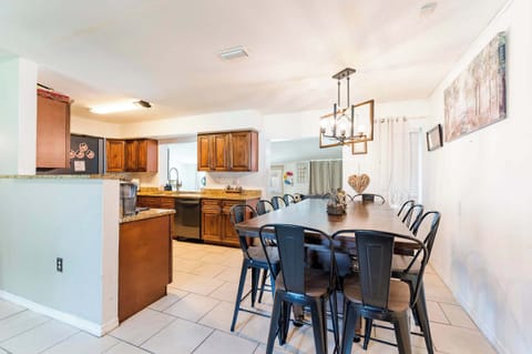 Dine Together! A massive farmhouse-style table and chic lighting offer plenty of seating for your whole group. Open access to the well-equipped kitchen!