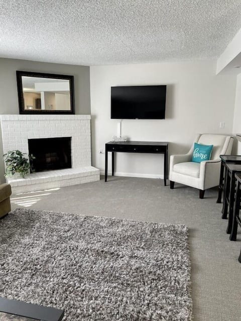 Very spacious Living room with TV and desk for taking care of work. 