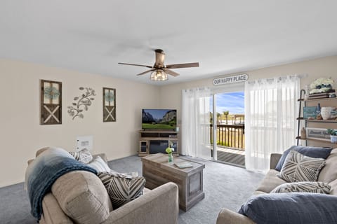 Living Room with couch and Loveseat. Smart TV and electric fireplace