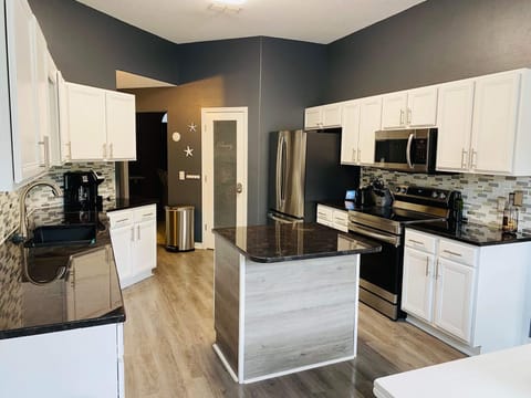 Kitchen with stainless steel appliances.