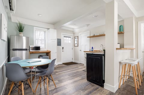 Bright dining area w/ modern table, ample seating & direct access to the kitchen.