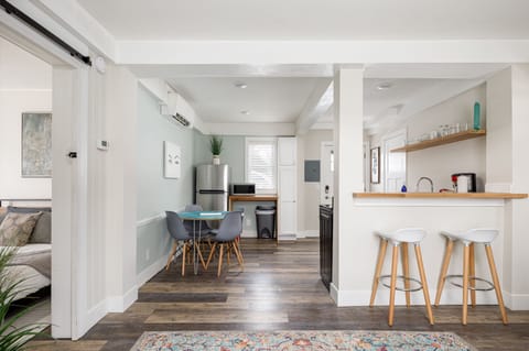 Spacious open-concept layout w/ breakfast bar seating & seamless flow into the kitchen.