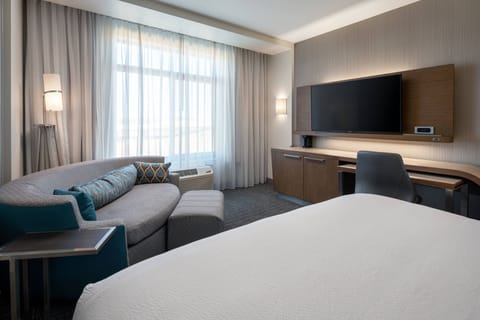 Desk, laptop workspace, iron/ironing board, free cribs/infant beds