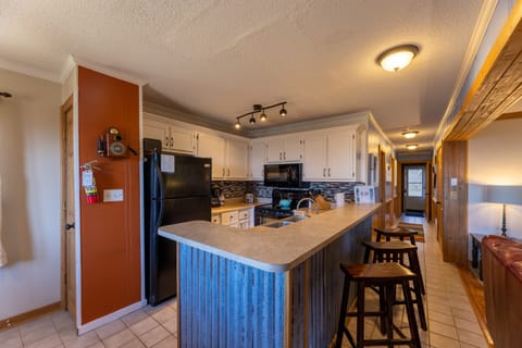 Kitchen counter with barstools.