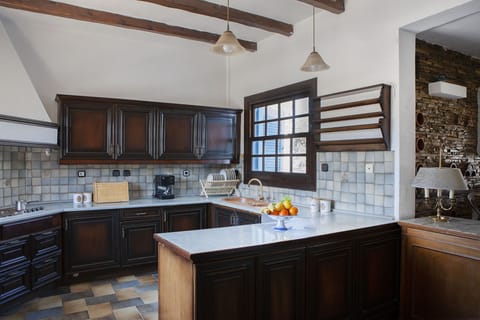 The bright and large kitchen offers all necessary amenities
