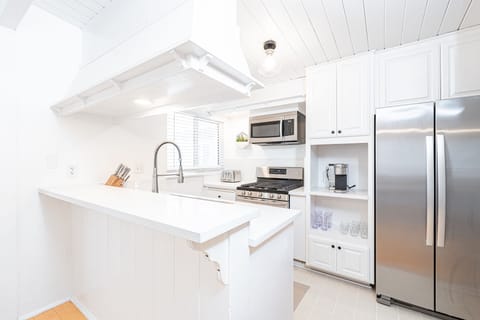 Kitchen comes stocked with dishes, utensils, cookware, bakeware, and all large and small appliances.
                