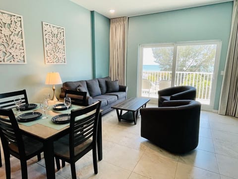 Sun-filled living area opening onto a Gulf-view balcony